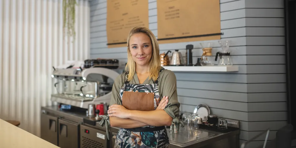 Cafe shop owner smiling